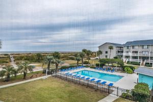 an image of a swimming pool at a resort at Beach and Pool Views! Newly Listed Villa on Harbor Island in Harbor Island