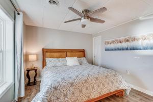 a bedroom with a bed and a ceiling fan at Waterfront Lake Tillery Home with Incredible Views! in Mount Gilead
