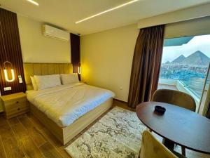 Giường trong phòng chung tại Rotana Pyramids View +37 ảnh