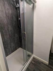 a shower with a glass door in a bathroom at Paradise Street Contractor Haven in Barrow in Furness