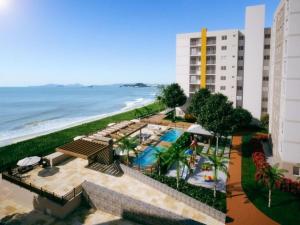 an aerial view of a hotel and the beach at Apto Brilho do Sol - Barra Velha - SC in Barra Velha
