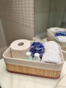 a container of toilet paper and towels on a counter at AURA MAR Mojácar Apartment in Mojácar