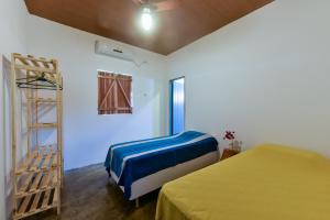 a room with two beds and a ladder in it at Fazenda Poço das Pedras in São João do Cariri
