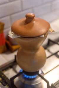 a close up of a wooden object on top of a stove at Fazenda Poço das Pedras in São João do Cariri