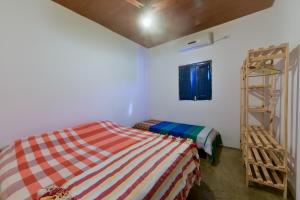 a bedroom with two beds and a ladder in it at Fazenda Poço das Pedras in São João do Cariri