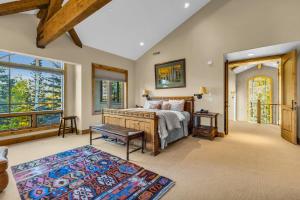 a bedroom with a bed and a large window at Serenity at The Colony in Park City
