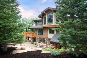 a large house in the woods with trees at Serenity at The Colony in Park City