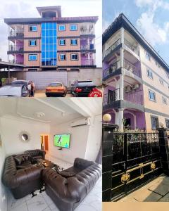 a living room with a couch and a tv in front of a building at Résidence Sighaka - Suite Royale - WiFi, Gardien, Parking in Douala