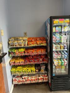 a refrigerator filled with lots of different types of food at Super 8 by Wyndham Carlisle North in Carlisle