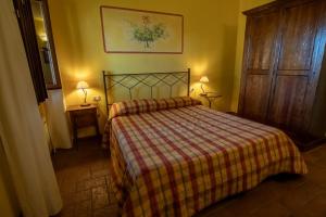 Postel nebo postele na pokoji v ubytování Agriturismo Buratta