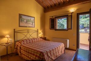 Postel nebo postele na pokoji v ubytování Agriturismo Buratta