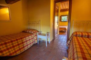 Postel nebo postele na pokoji v ubytování Agriturismo Buratta