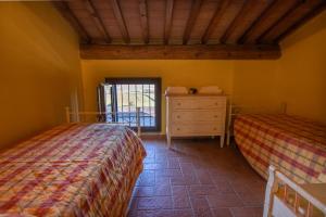 Postel nebo postele na pokoji v ubytování Agriturismo Buratta