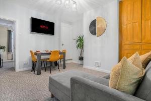 a living room with a couch and a table at Sophie's House in Nottingham