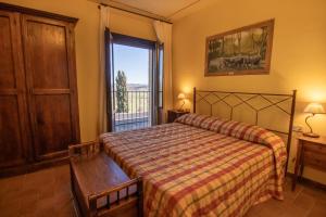 Postel nebo postele na pokoji v ubytování Agriturismo Buratta