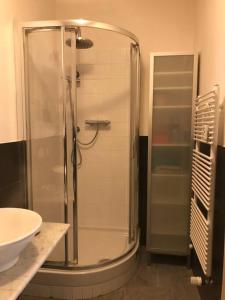 a shower in a bathroom with a sink at Easy Florence Suite - 50mt Tram T2 in Florence