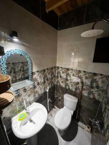 a bathroom with a white toilet and a sink at Apartment dahab in Dahab
