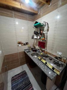 a small kitchen with a sink and a counter at Apartment dahab in Dahab