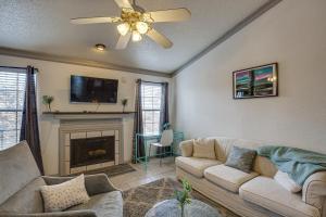 a living room with a couch and a fireplace at Inviting Dallas Condo Less Than 2 Mi to NorthPark! in Dallas