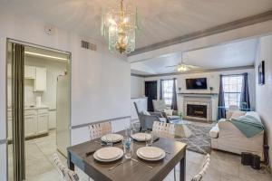 a dining room and living room with a table and chairs at Inviting Dallas Condo Less Than 2 Mi to NorthPark! in Dallas
