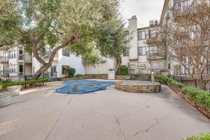 a courtyard with a fire pit in front of a building at Inviting Dallas Condo Less Than 2 Mi to NorthPark! in Dallas
