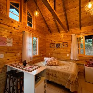 En eller flere senge i et værelse på Alto da Montanha