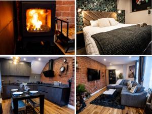 uma cozinha e uma sala de estar com lareira em VIP - 2 BR Grade 2 Luxury Industrial House with Log Burning FIRE & electric blinds in the Heart of the JQ em Birmingham