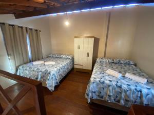 Katil atau katil-katil dalam bilik di Chalé Visão de Mar