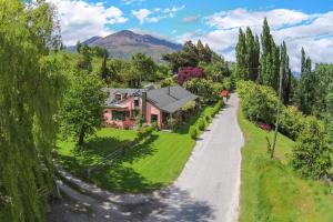 an aerial view of a house and a road at The Ferry Bed & Breakfast in Queenstown