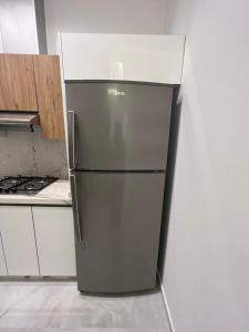 a stainless steel refrigerator in a kitchen at Malabata hills 3 bedroom in Tangier