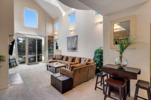 a living room with a couch and a table at Harbor Haven in Santa Cruz