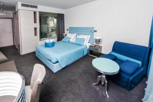 Кровать или кровати в номере Hotel Arupinum