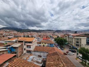 an aerial view of a city with buildings and cars at Casa Turismo Terres in Cusco