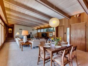a large living room with a table and chairs at Point Loma Woods in San Diego