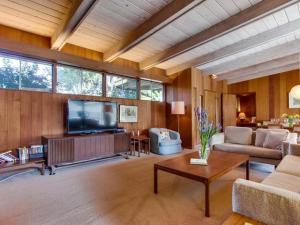 a large living room with a tv and a couch at Point Loma Woods in San Diego