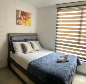 Postel nebo postele na pokoji v ubytování Hermoso Apartamento Chapinero + 8 fotografií