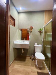 a bathroom with a toilet and a sink at Pousada Sonho Meu in Piranhas +18 photos