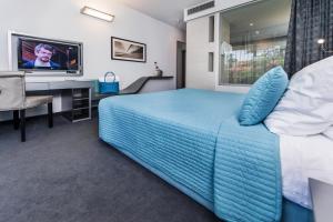 Телевизор и/или развлекательный центр в Hotel Arupinum