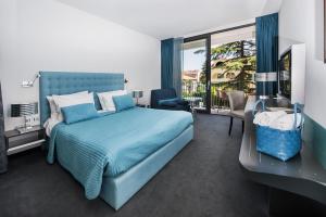 Кровать или кровати в номере Hotel Arupinum