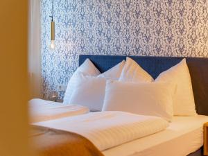 Posteľ alebo postele v izbe v ubytovaní Kaminzimmer Suite