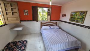 Ένα ή περισσότερα κρεβάτια σε δωμάτιο στο Cantinho da Ilha