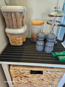 a shelf in a refrigerator filled with food at House on the Hill in New Plymouth