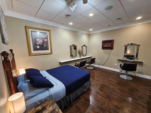 a bedroom with a blue bed and two mirrors at Saratoga Family Spa in Ballston Spa