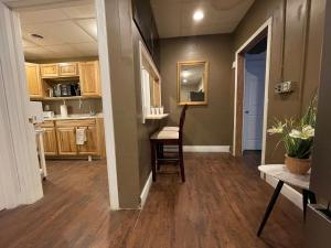 a kitchen with a table and a chair in a room at Saratoga Family Spa in Ballston Spa