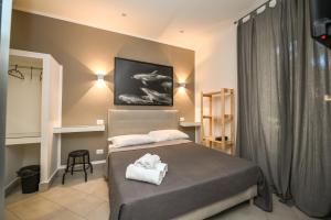 A bed or beds in a room at Living Salerno B&b