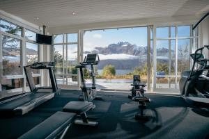 a gym with a view of a mountain at Rosewood Matakauri in Queenstown