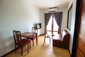 TV a/nebo společenská místnost v ubytování Tai-Shan Suites