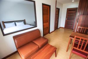 Postel nebo postele na pokoji v ubytování Tai-Shan Suites