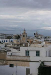 a view of a city from the roofs of buildings at Dar mima baya in Tunis