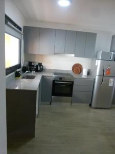 Kuchyň nebo kuchyňský kout v ubytování Departamento RUKA-9 + 12 fotografií